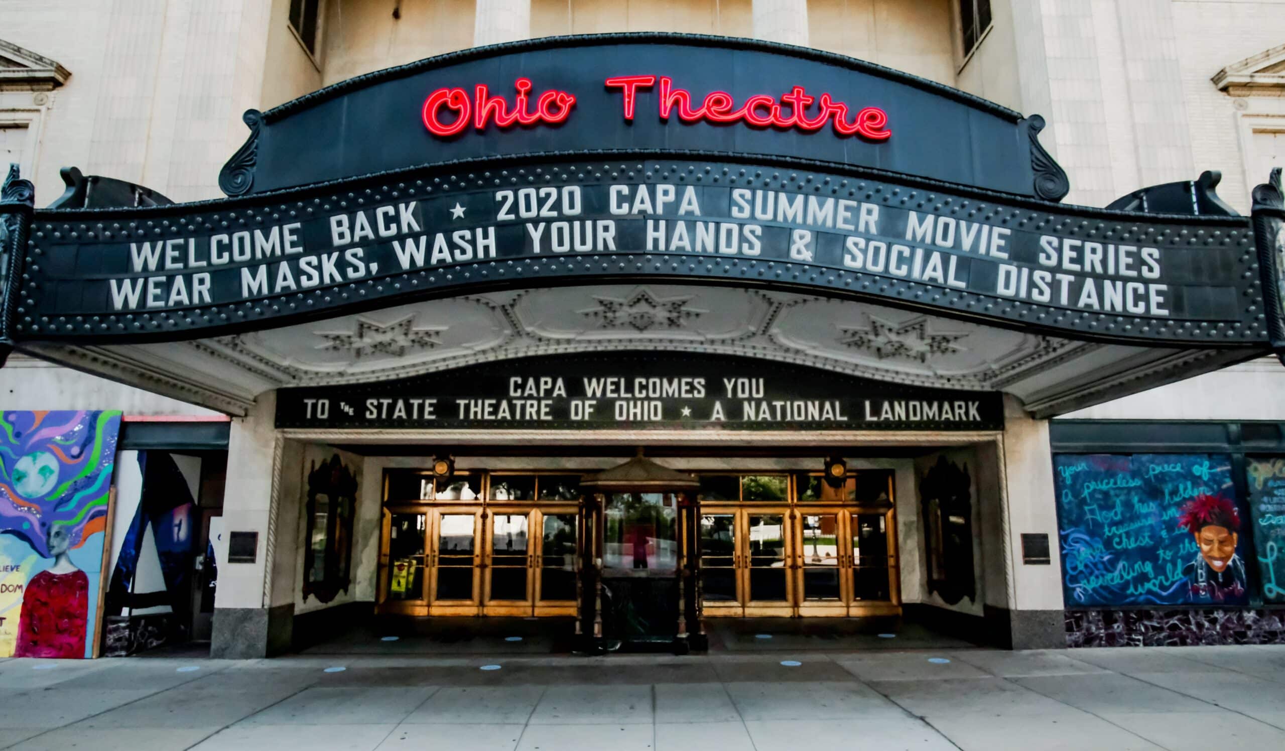 Marquee at Ohio Theatre reads: "Welcome Back ● 2020 CAPA Summer Movie Series ● Wear Masks, Wash Your Hands & Social Distance." Entrance doors and "State Theatre of Ohio" text visible.